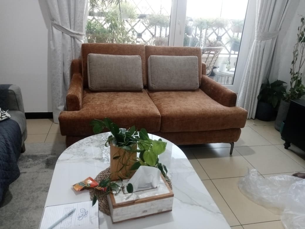 Custom rust fabric sofa delivered and installed by Dune Home Dubai